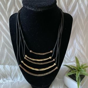 Multi strands with black cord and gold tone curve bar pendant necklace